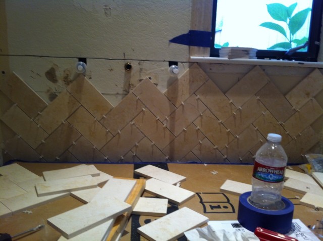 Herringbone tile installation startwithfourwalls.com