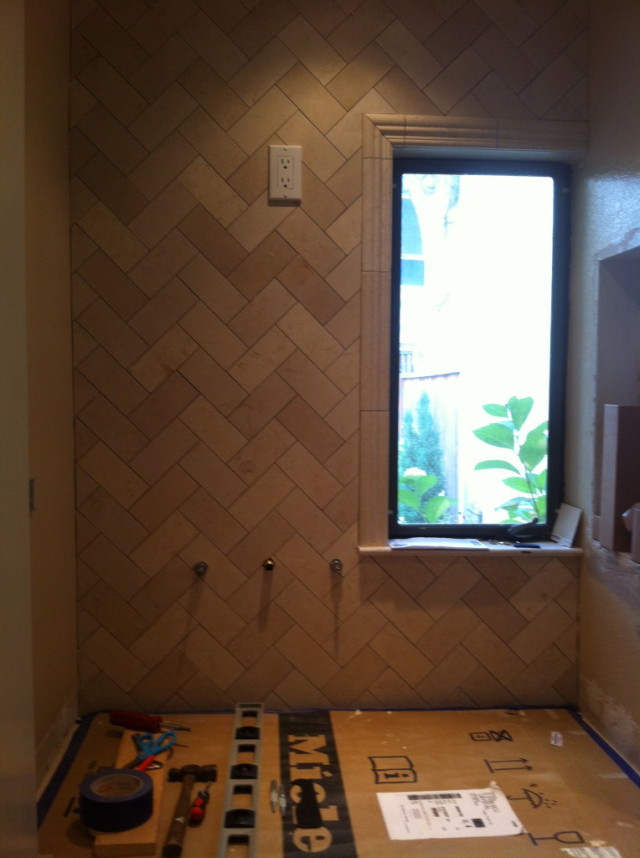 Herringbone tile installation startwithfourwalls.com