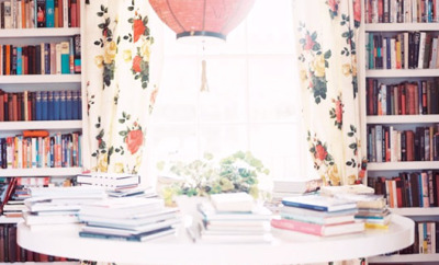bookcases and floral drapes in dining area