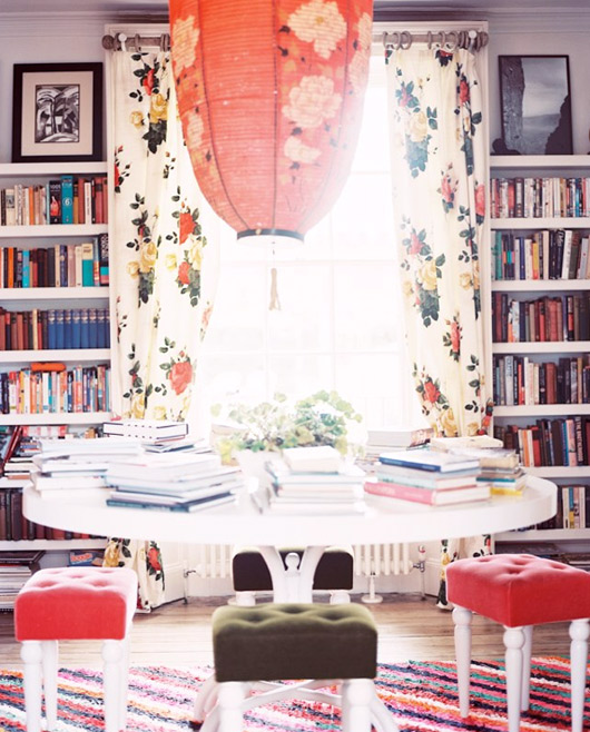 bookcases and floral drapes in dining area